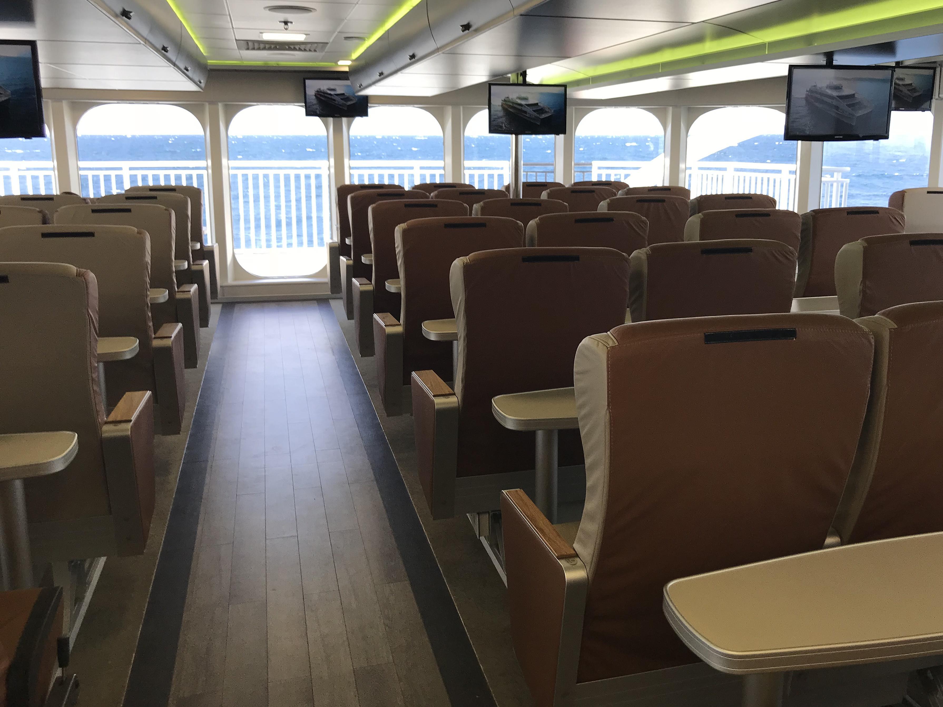 Halunder Jets's seating rows with view from the back towards the windows.