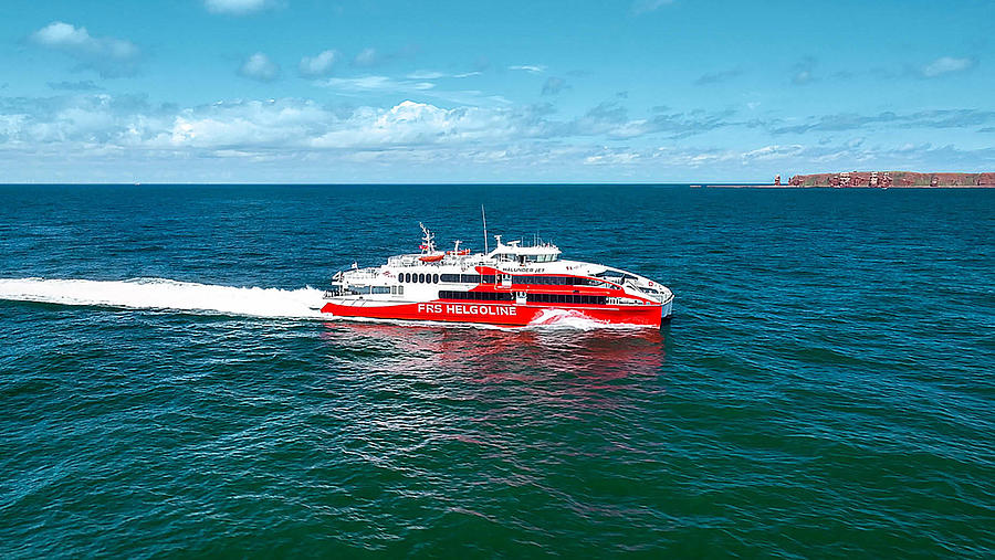 "Halunder Jet" on the sea with Heligoland in the back