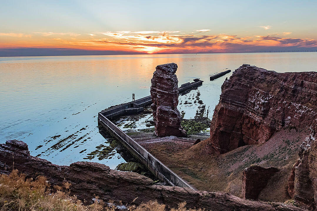 Sunset on the island of Heligoland, in the front: "Lange Anna"