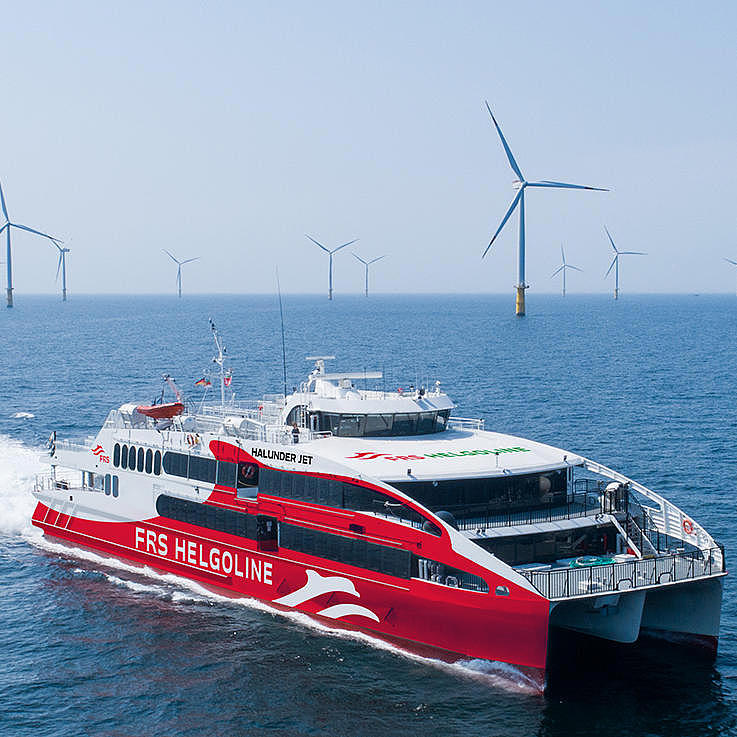 Halunder Jet in front of an offshore windpark